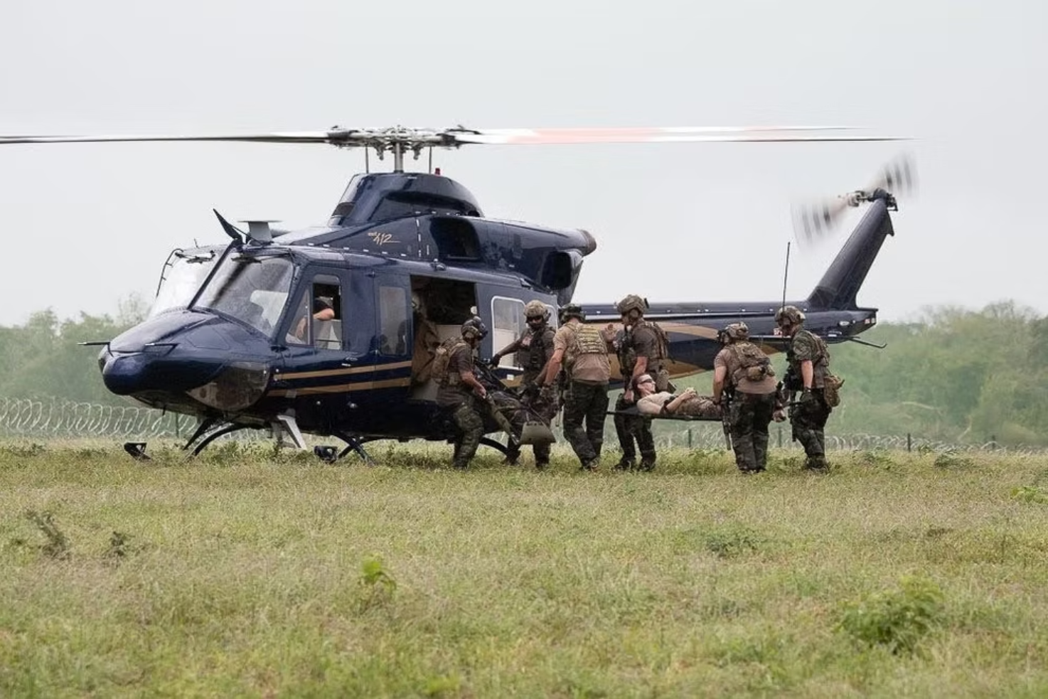XPJ team carrying casualty to helicopter