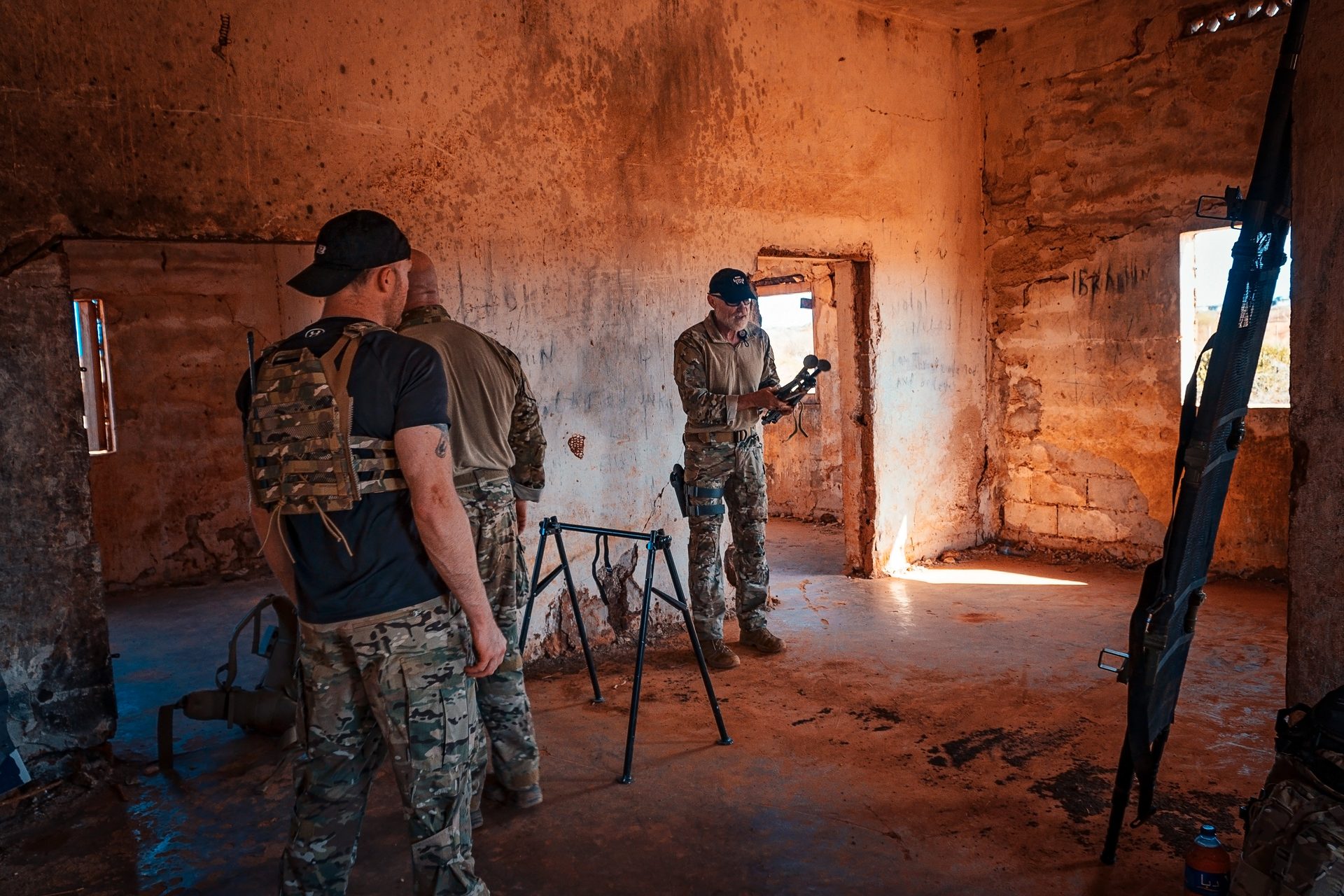 Operators conducting CQB room clearing training in abandoned building
