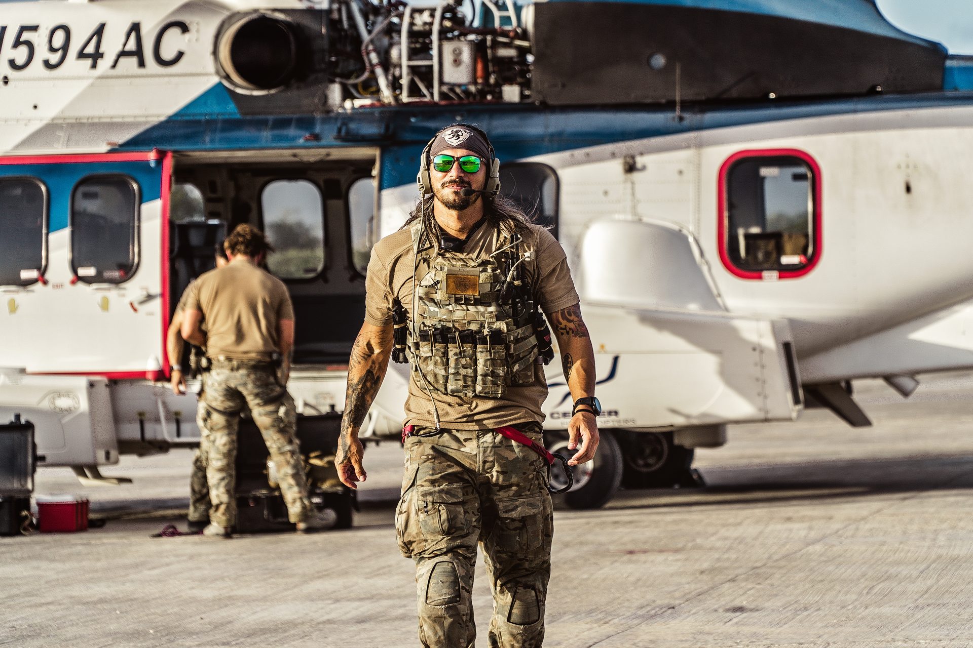 XPJ operator walking from helicopter on tarmac