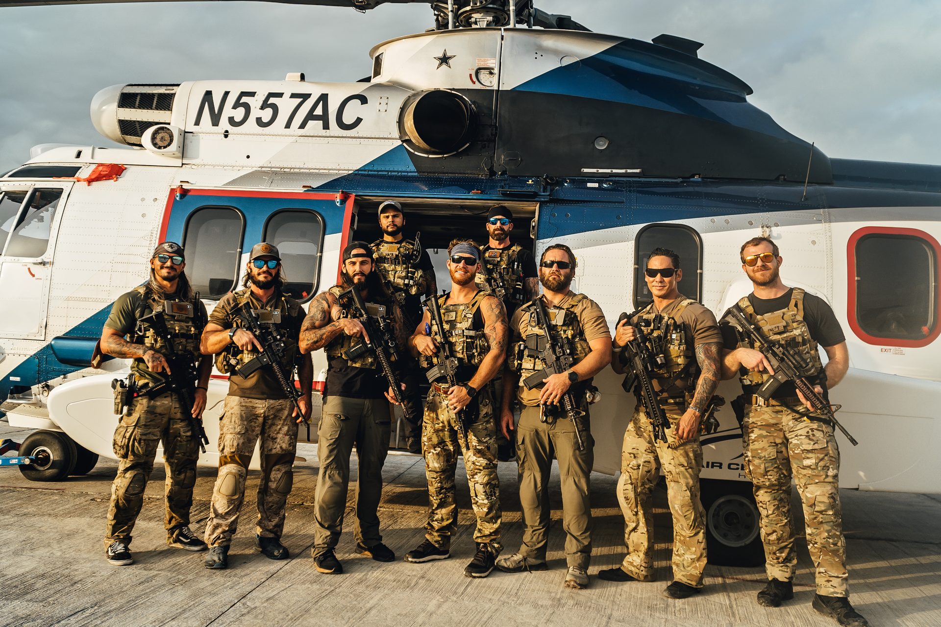 XPJ Global full team in front of helicopter