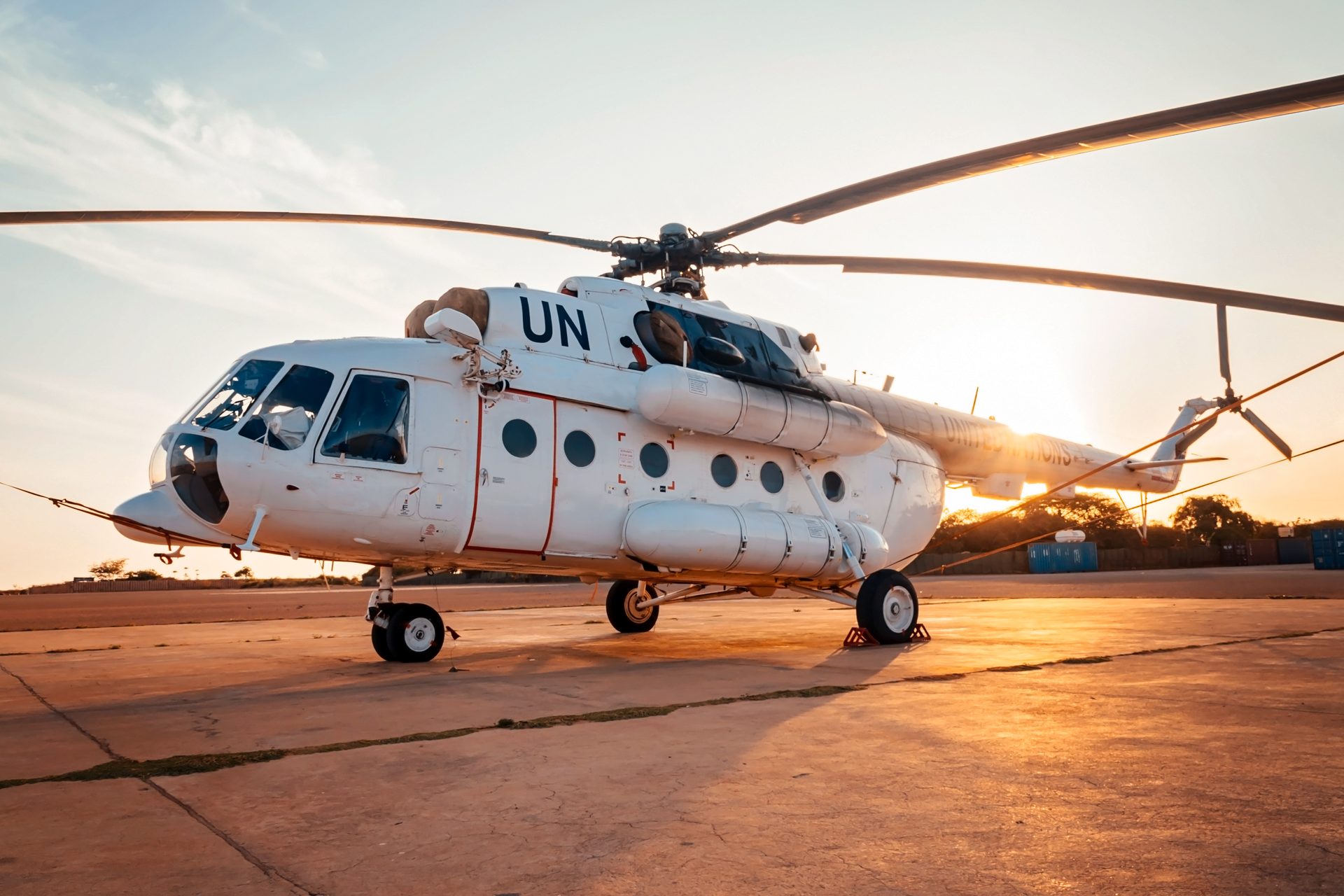 UN helicopter on tarmac at sunset in Somalia